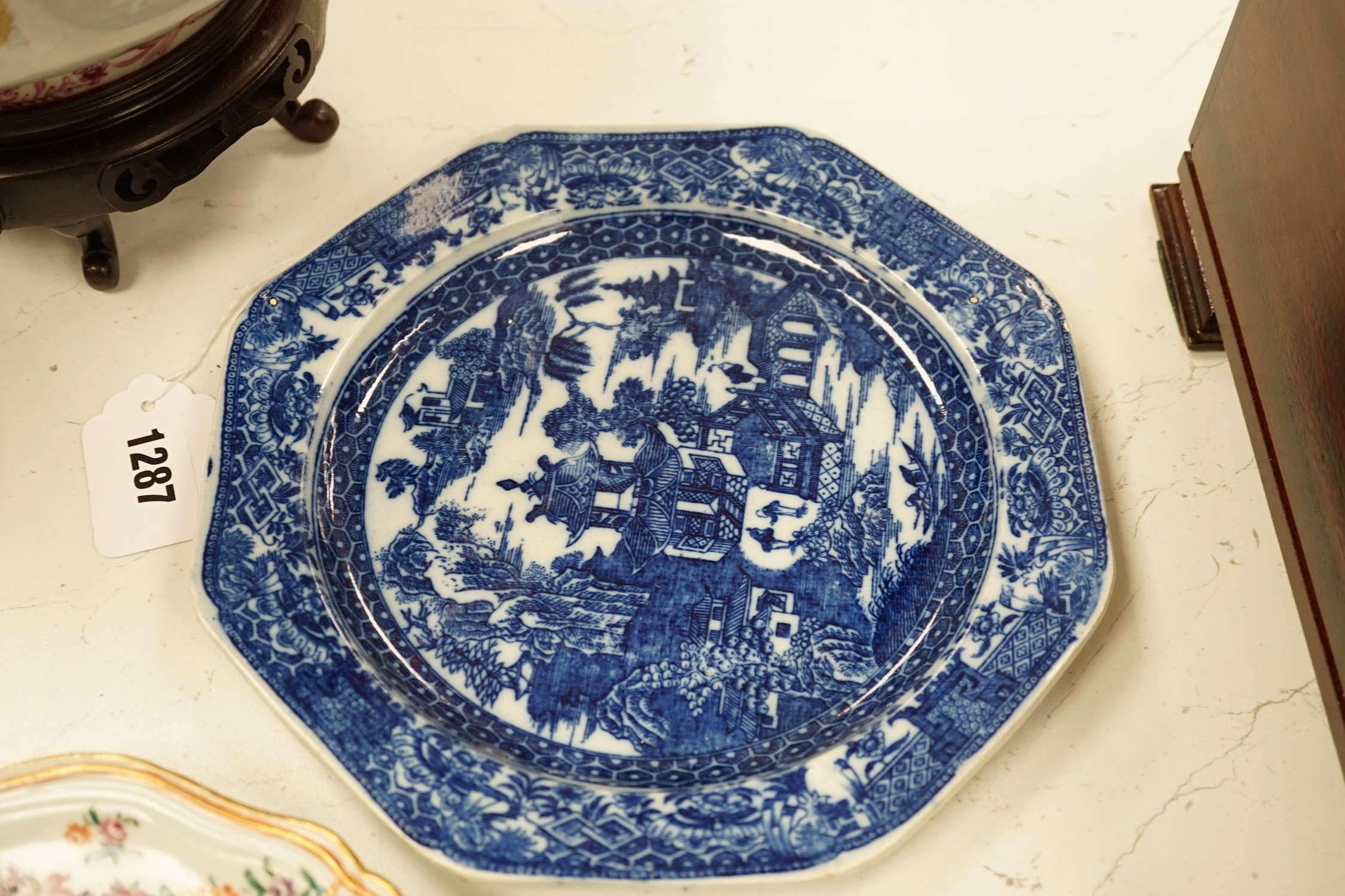 A Chinese export armorial soup plate, for the Spanish market, Qianlong period, with a Spanish coat of arms, possibly Aguado de Las Marismas, an 18th century Chinese export punch bowl on stand, a Chinese blue and white pl